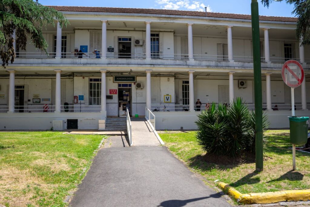 A hospital building with a path to the entrance