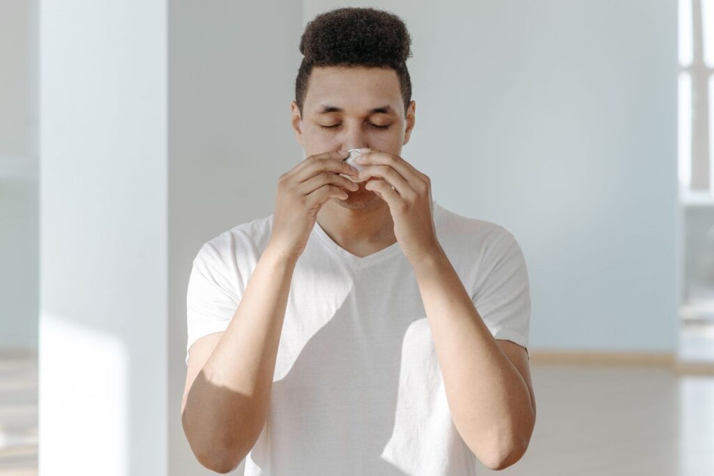 A man blowing his nose