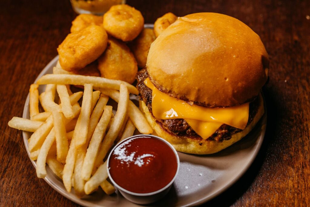 A greasy plate of burger and fries