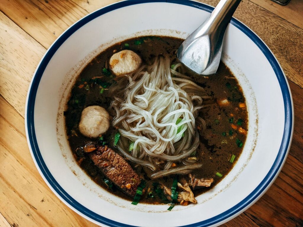 A bowl of Thai beef noodle soup