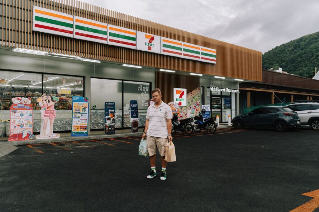 A shopper outside a 7-Eleven store in Thailand