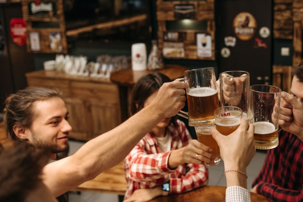 Friends raising glasses of beer