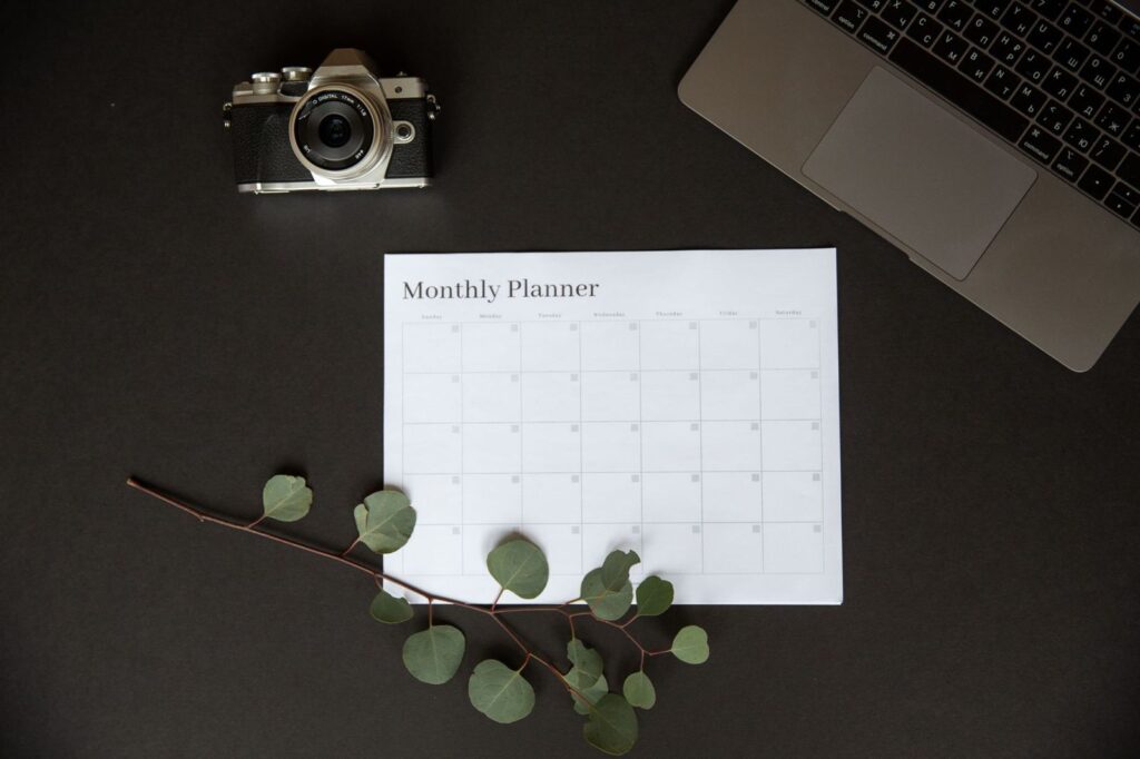 A blank monthly planner on a desk