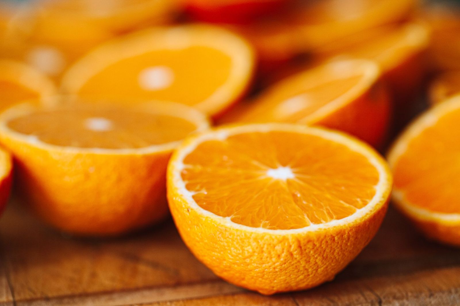 Fresh oranges cut in half, a natural source of vitamin C