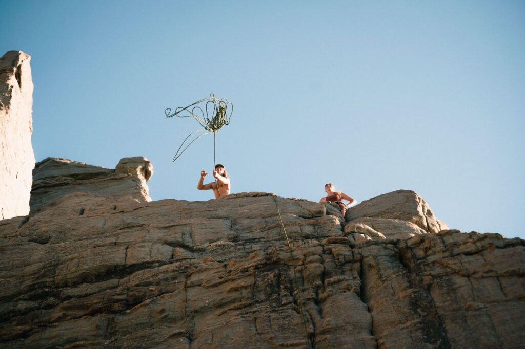 People standing on top of a rocky cliff