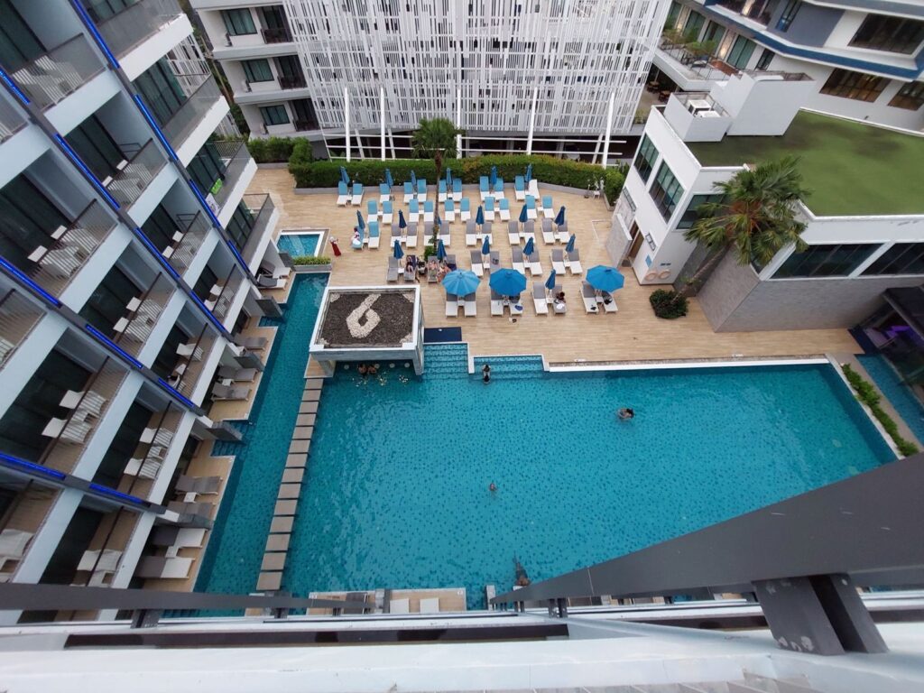 Looking down on a condo building's pool