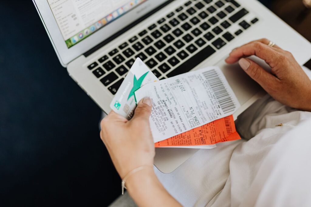 Checking a receipt while working on a laptop