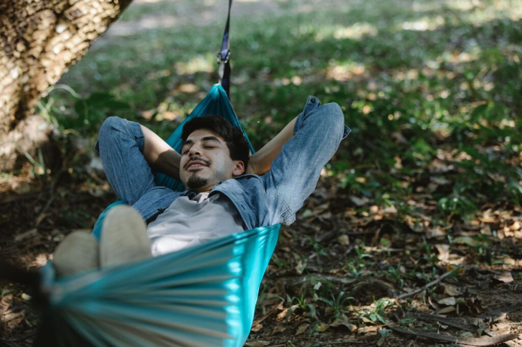 A man resting in a hammock