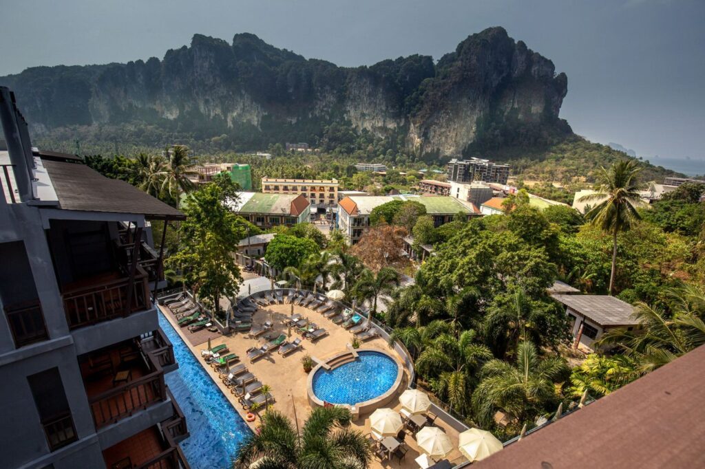 Resort pools below the limestone cliffs of Ao Nang