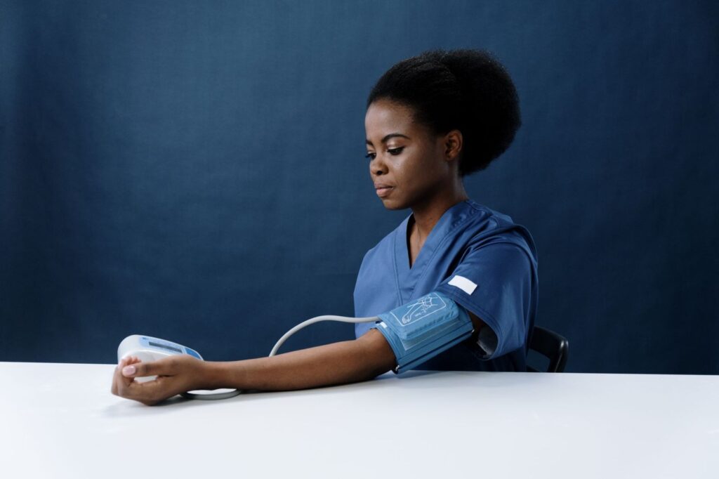 A nurse taking a blood pressure reading