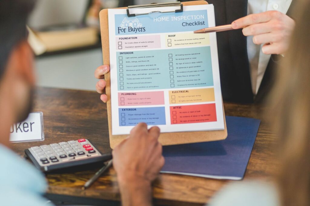 Pointing at a checklist on a clipboard