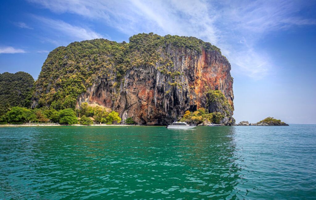 Limestone cliffs rising from emerald water