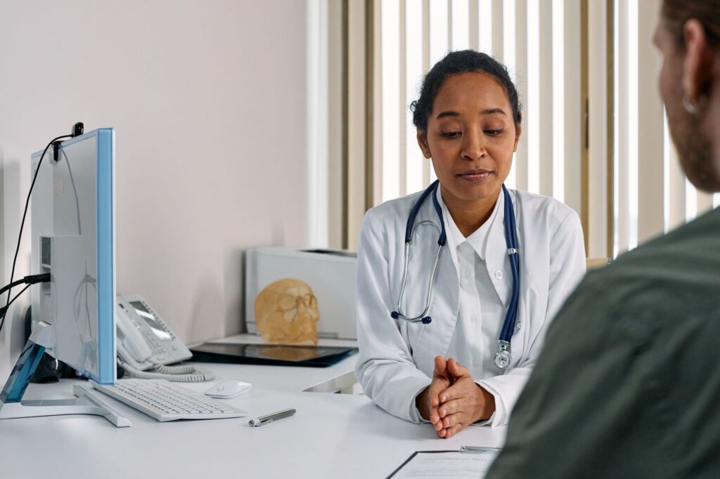 A doctor talking with a patient