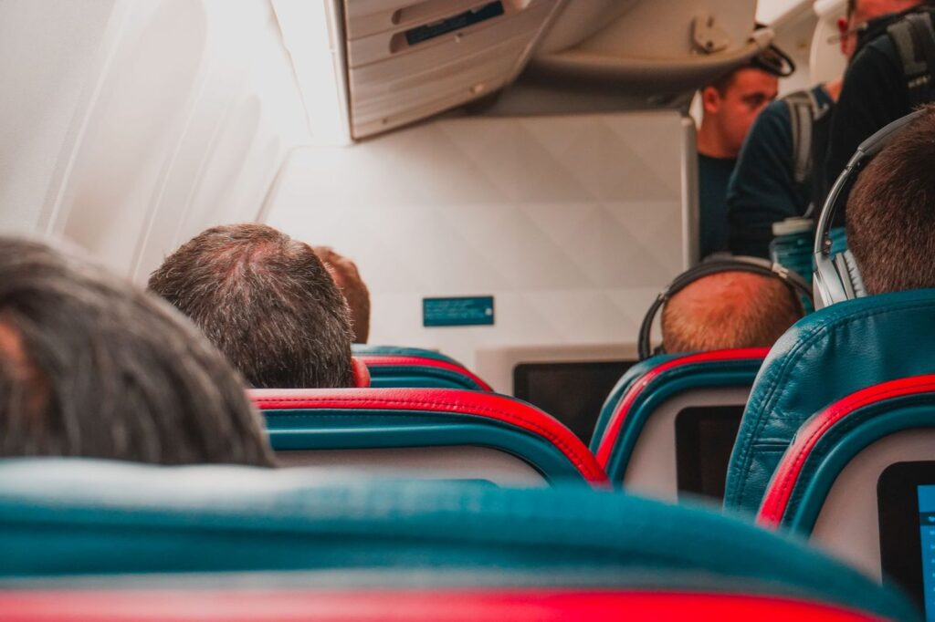 Passengers in their seats on a long flight