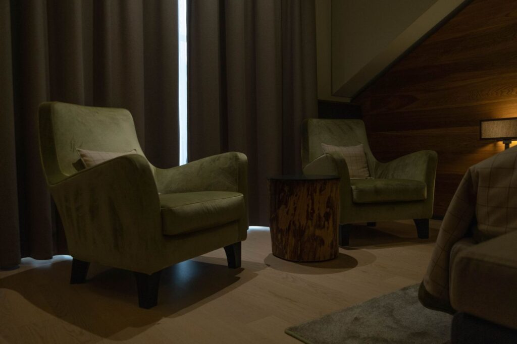 Comfortable armchairs in a quiet, dimly lit room