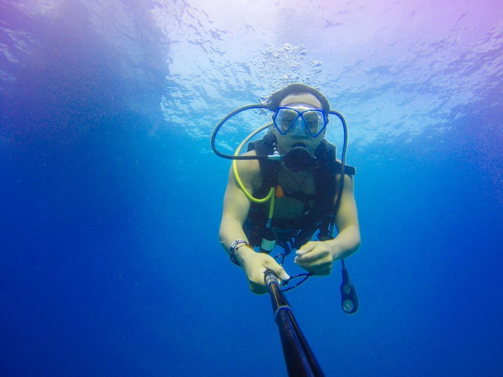 A scuba diver in clear blue water