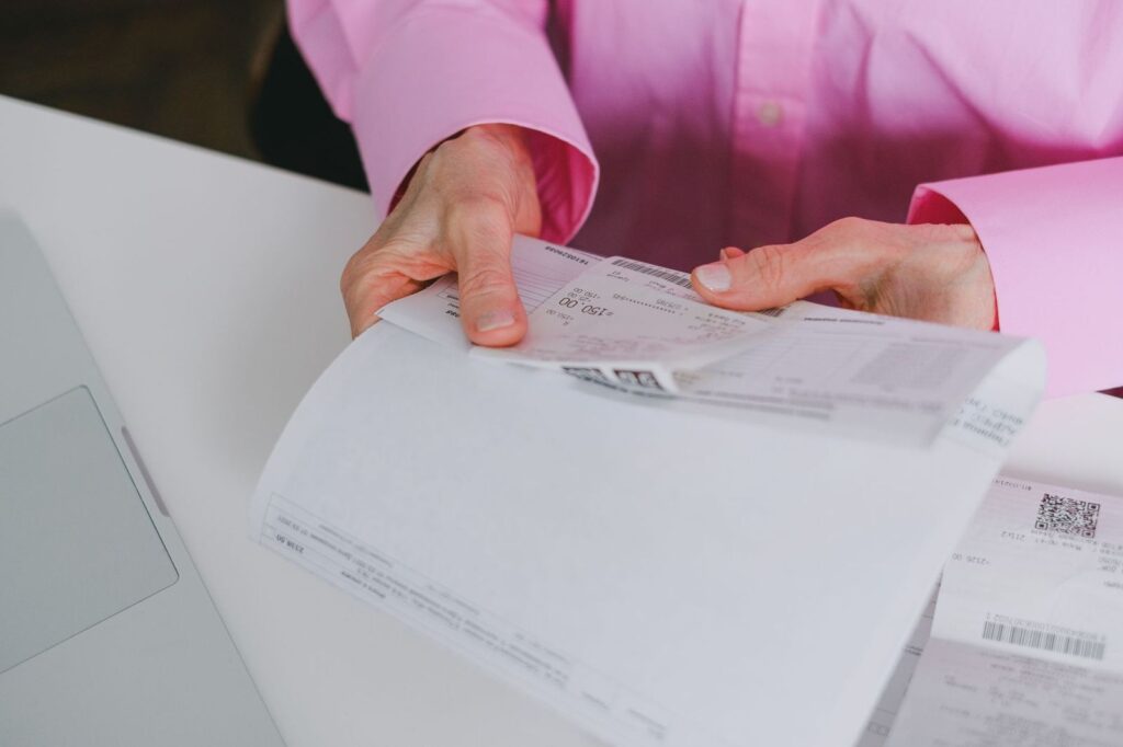 Paper receipts being sorted for a claim
