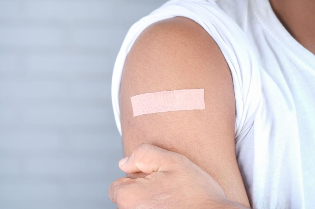 A small plaster on an upper arm