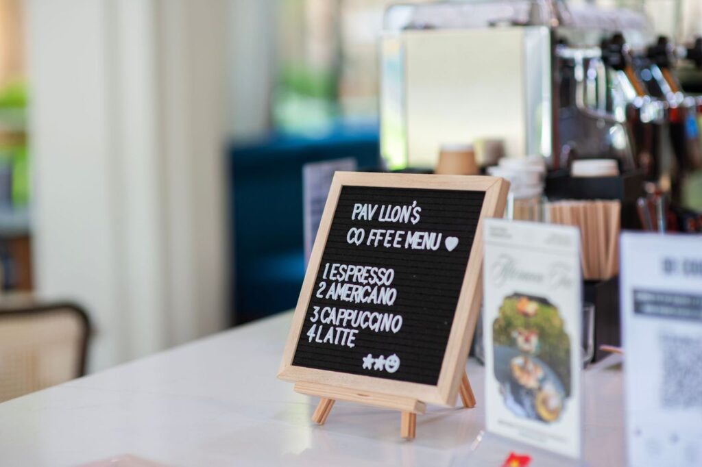 A small menu board on a café counter